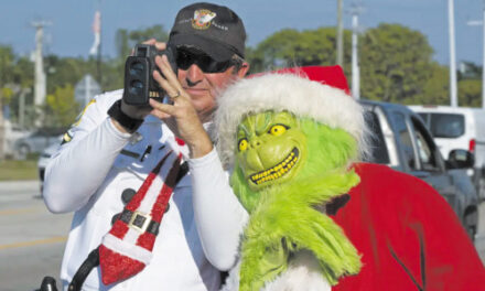 Deputy Dressed As Grinch Gives Onions To Speeding Drivers
